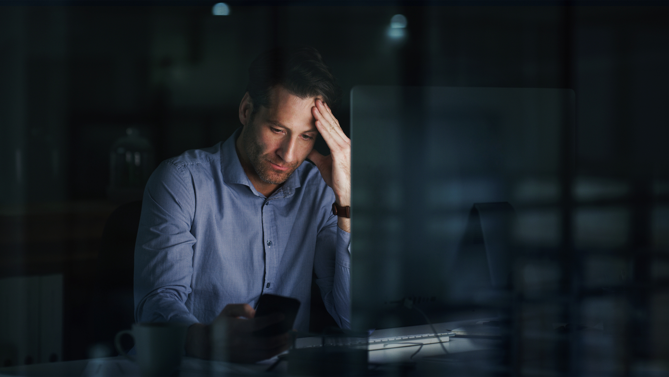 Stressed CFO working late at night